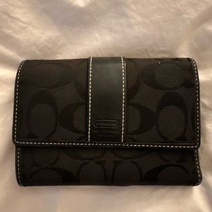 Black coach wallet.  Used.  Good condition